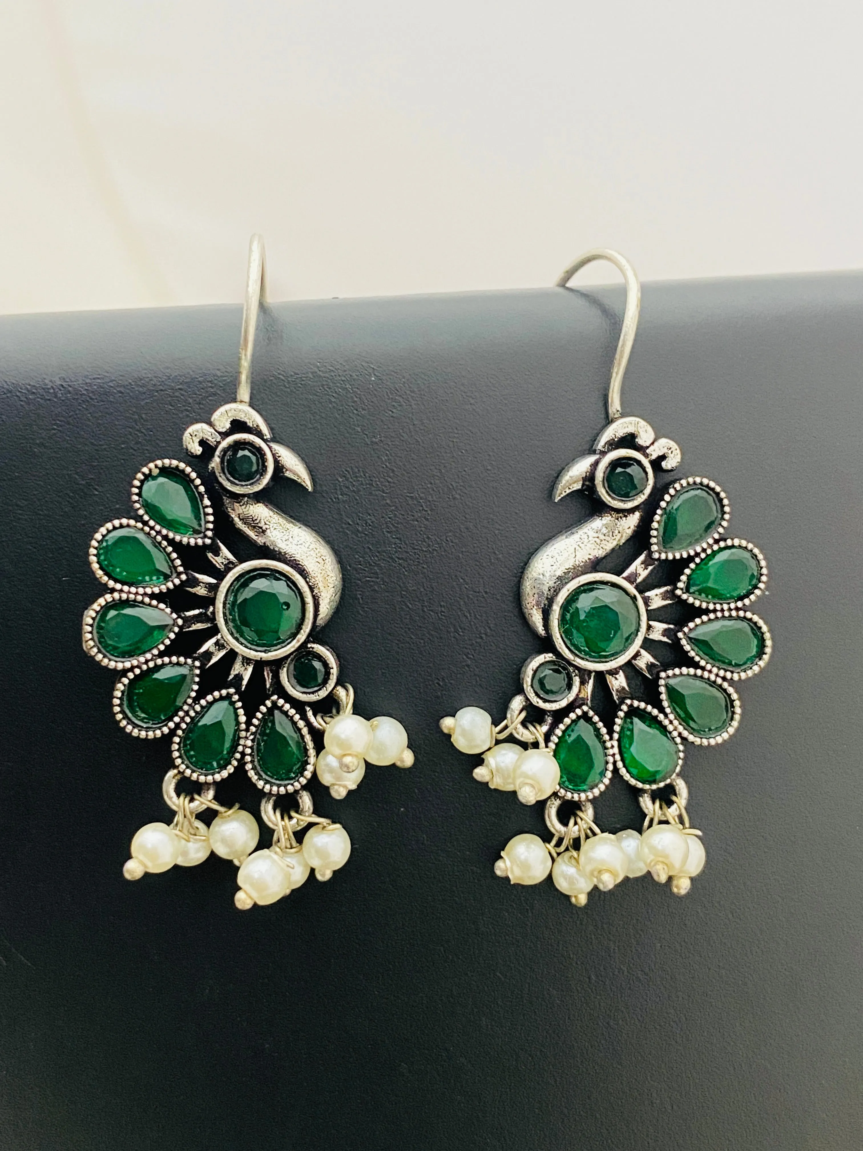 Elegant Emerald Stone Studded Peacock Designed Silver Plated Oxidized Hook Earrings