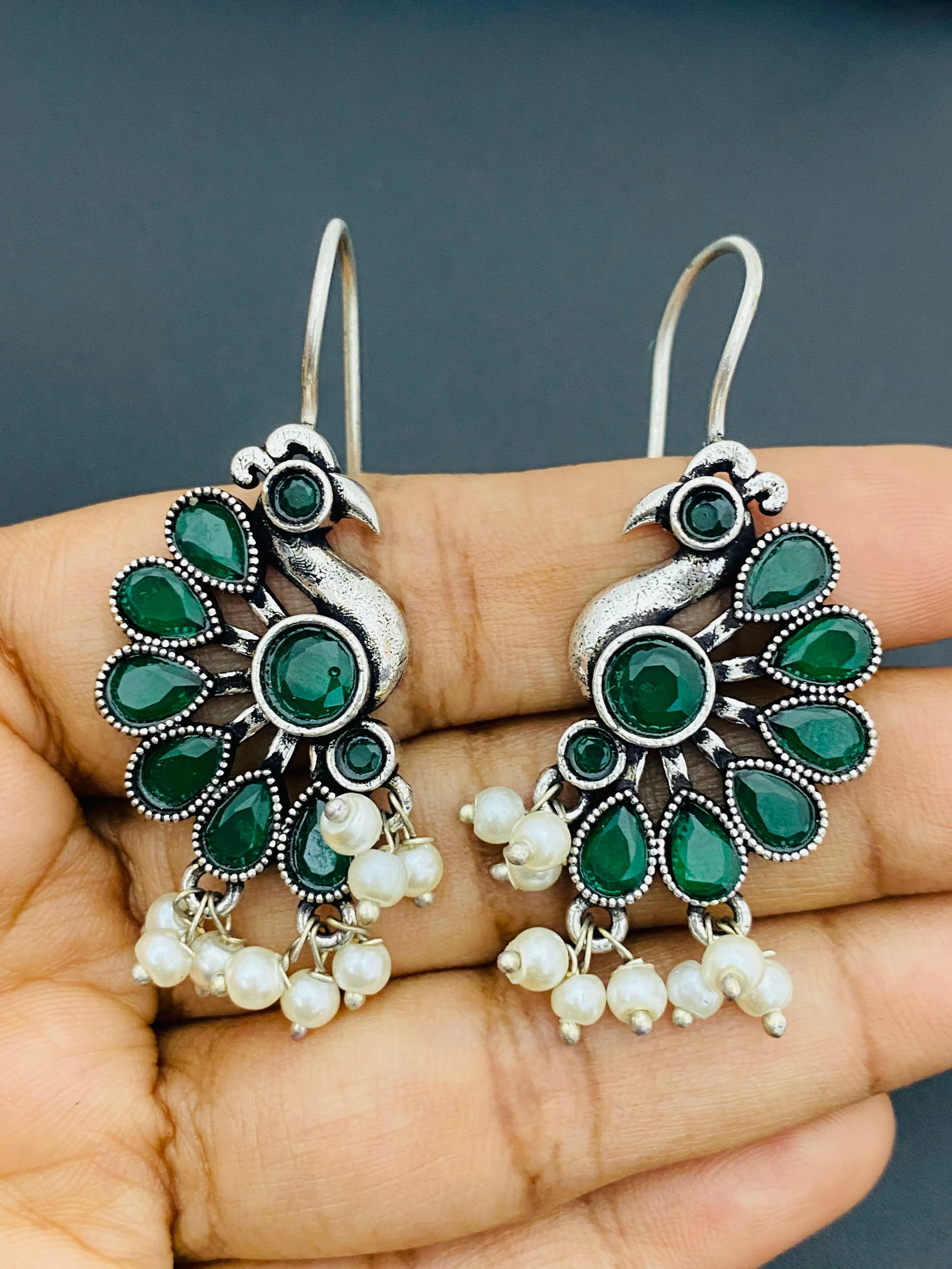 Elegant Emerald Stone Studded Peacock Designed Silver Plated Oxidized Hook Earrings