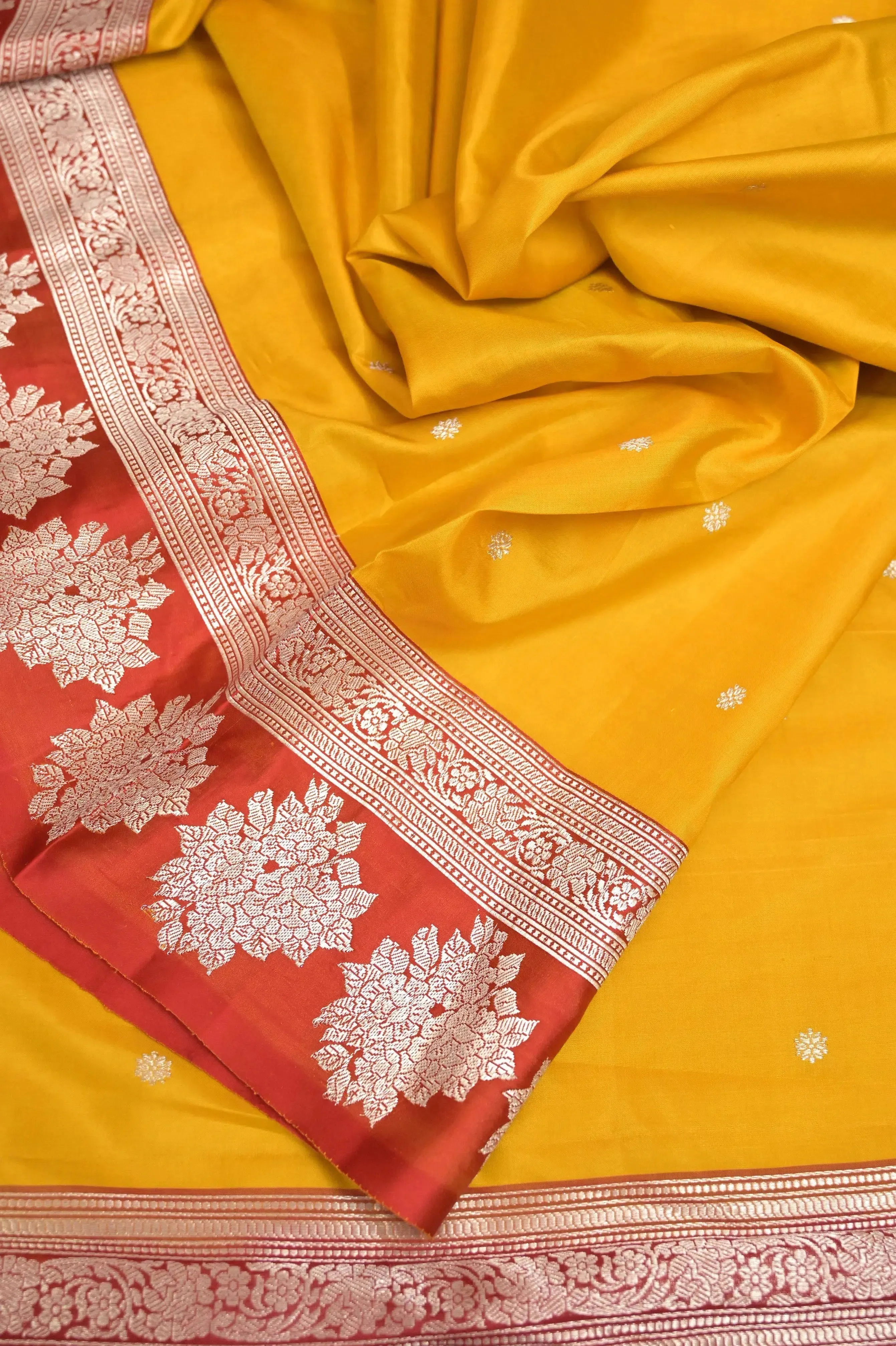 Yellow and Red Color Katan Banarasi Saree with Silver Buti and Zari Border